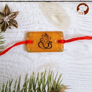 Divine Ganpati Rakhi | Sacred Om Ganesha Rakhi | Vibrant Ganesha Rakhi | Om Ganpati Rakhi | Spiritual Ganesha Rakhi | Ganesha Om Rakhi | Resin Ganpati Rakhi - Sacred Yellow Rakhi